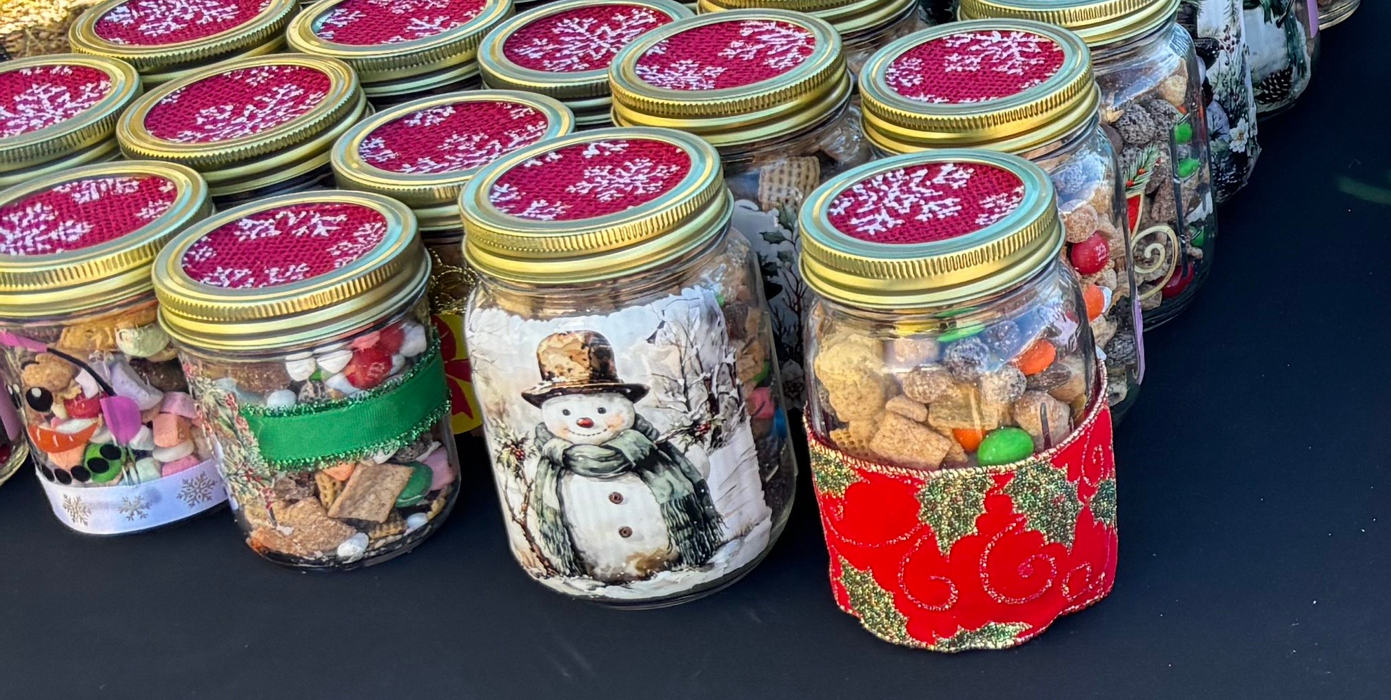 Festive holiday gift jars filled with homemade snack mixes