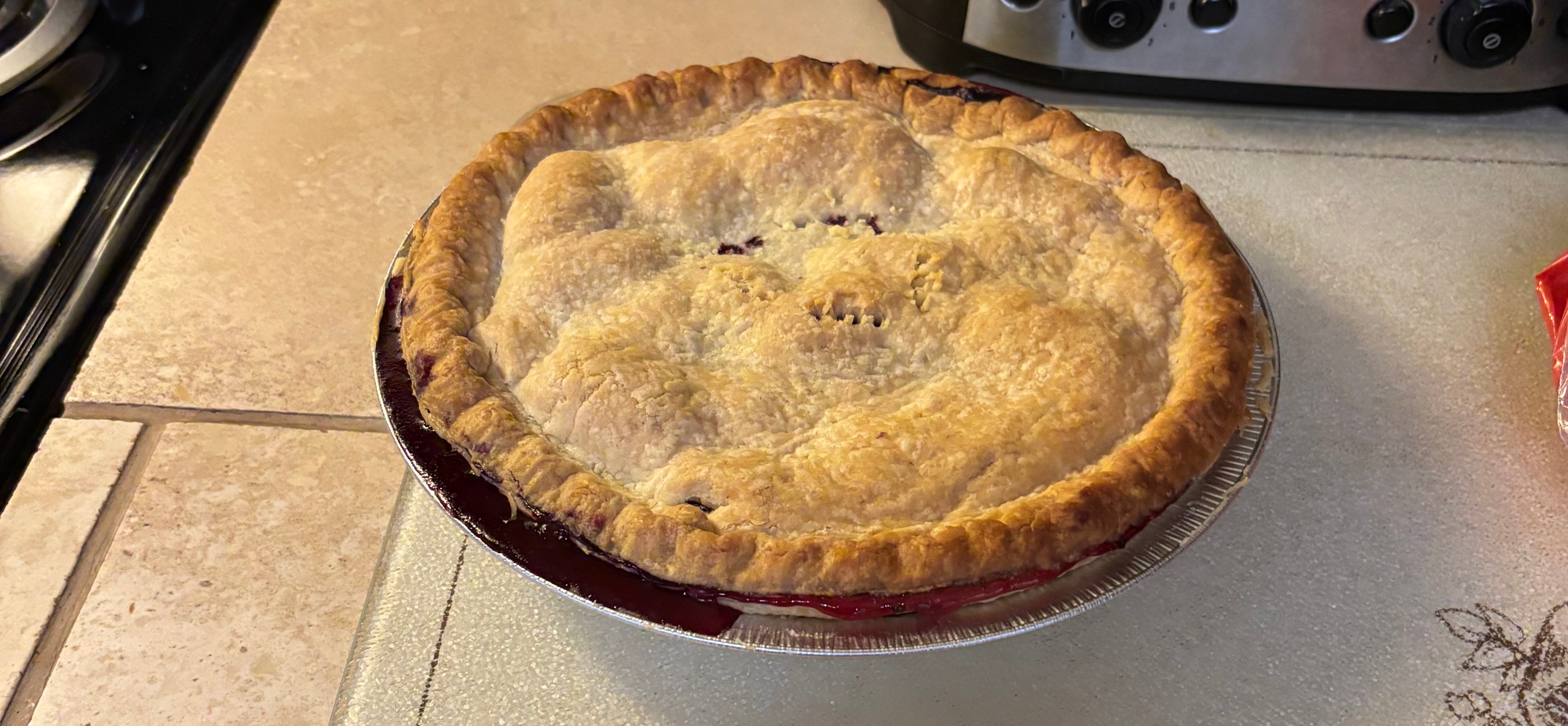 Homemade berry pie with golden crust